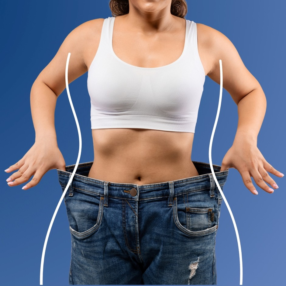 girl in bra and oversized jeans showing weight loss